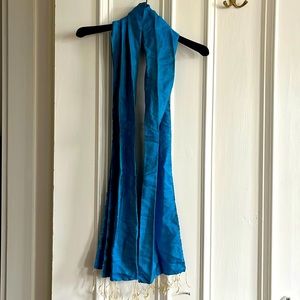 Chan Luu cerulean blue silk scarf with yellow contrast threading and tassels.